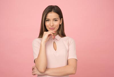 A beautiful Russian woman in a pink dress